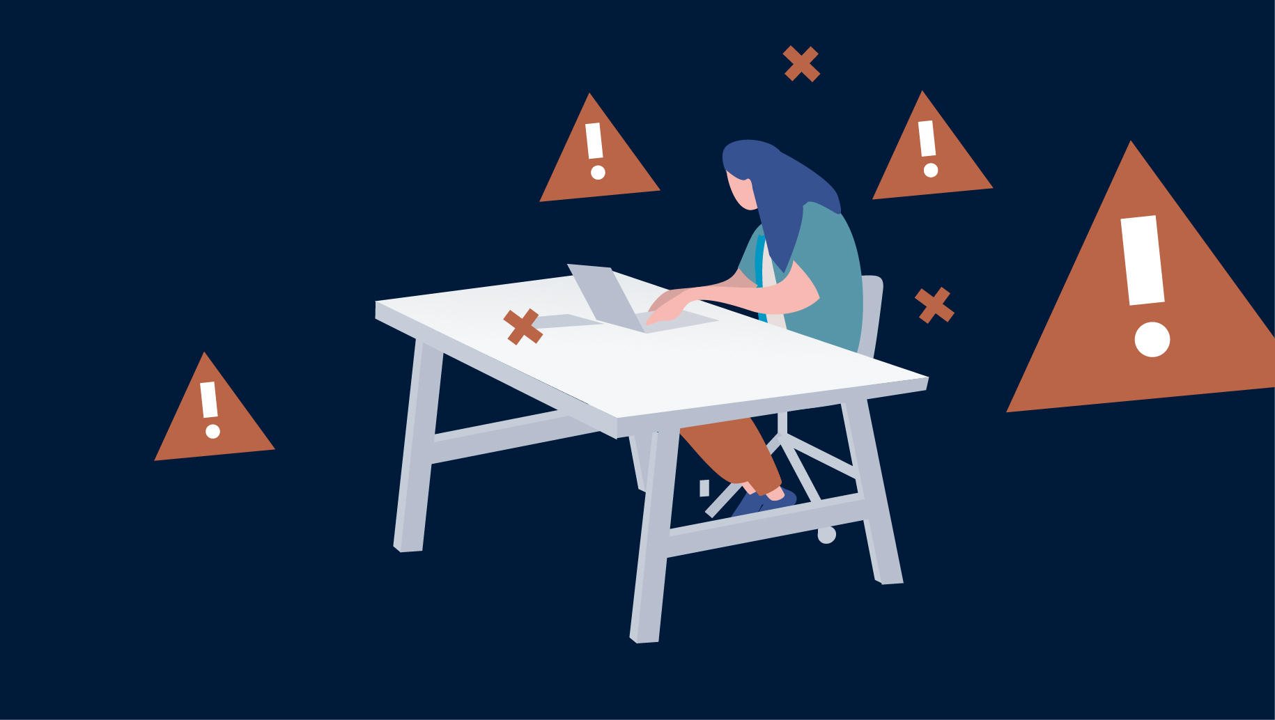 A person sitting at a desk using a laptop with warning